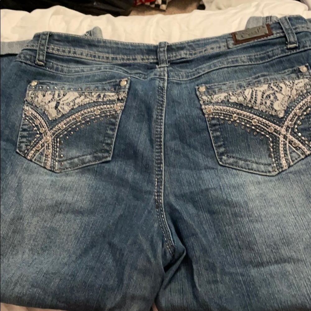 Capri length pants with embellished pockets